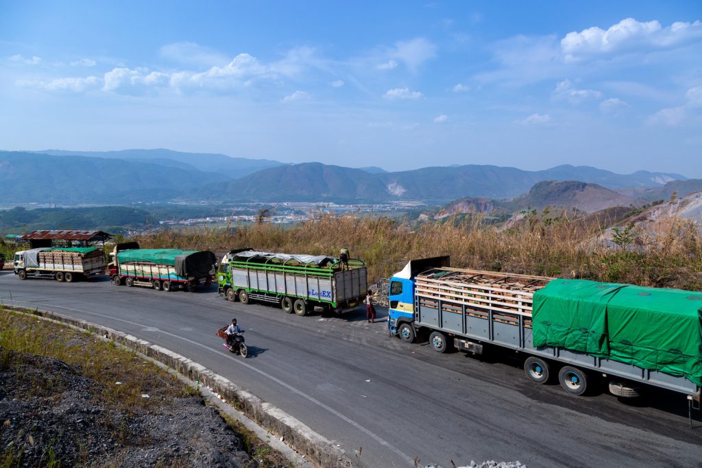 Trucks wait near Muse in Shan State to enter China on April 20 after Chinese authorities introduced restrictions to combat the spread of COVID-19. (AFP)