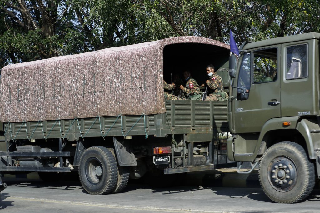 A military truck full of soldiers patrols the entrance to the municipal guesthouse in Nay Pyi Taw where MPs are staying at around 3:30pm on February 1. (Nyein Su Wai Kyaw Soe | Frontier)
