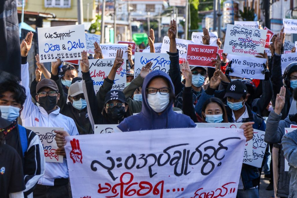 Protesters in the Shan State capital Taunggyi make the three-finger salute during an anti-coup demonstration for "Global Myanmar Spring Revolution Day" on May 2. (AFP)